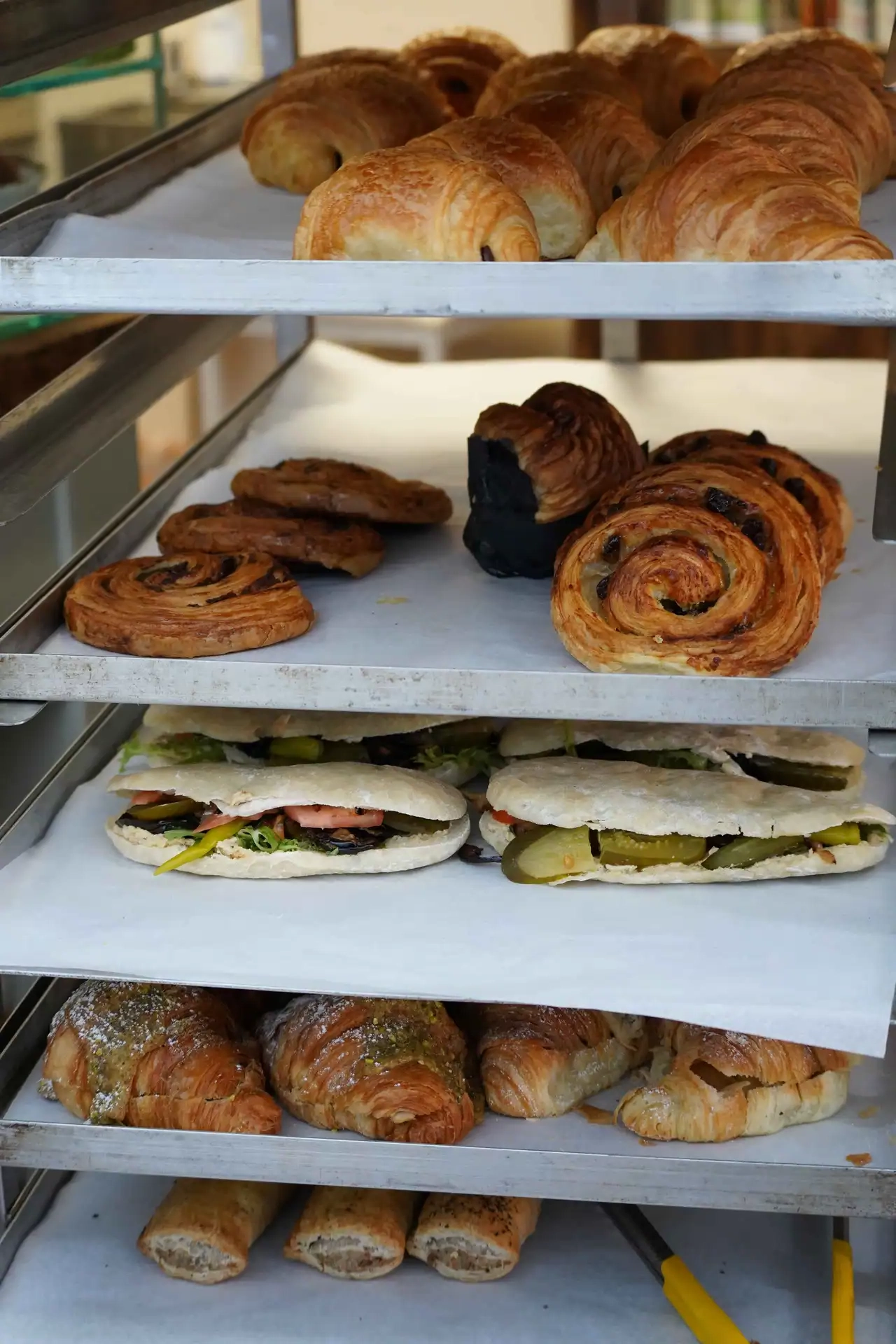 Freshly baked artisan breads and pastries on trays